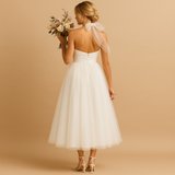 Carlena | Elegancka sukienka midi z halterowym dekoltem