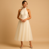 Carlena | Elegancka sukienka midi z halterowym dekoltem