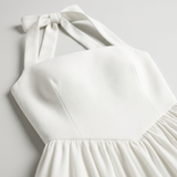 Carlena | Elegancka Sukienka Midi Halter z Rozkloszowaną Spódnicą i Kieszeniami