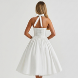 Carlena | Elegancka Sukienka Midi Halter z Rozkloszowaną Spódnicą i Kieszeniami