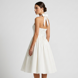 Carlena | Elegancka Sukienka Midi Halter z Rozkloszowaną Spódnicą i Kieszeniami
