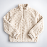 Pluszowy sweter oversize z warkoczem i zamkiem w kolorze kremowym – ułożony na płasko